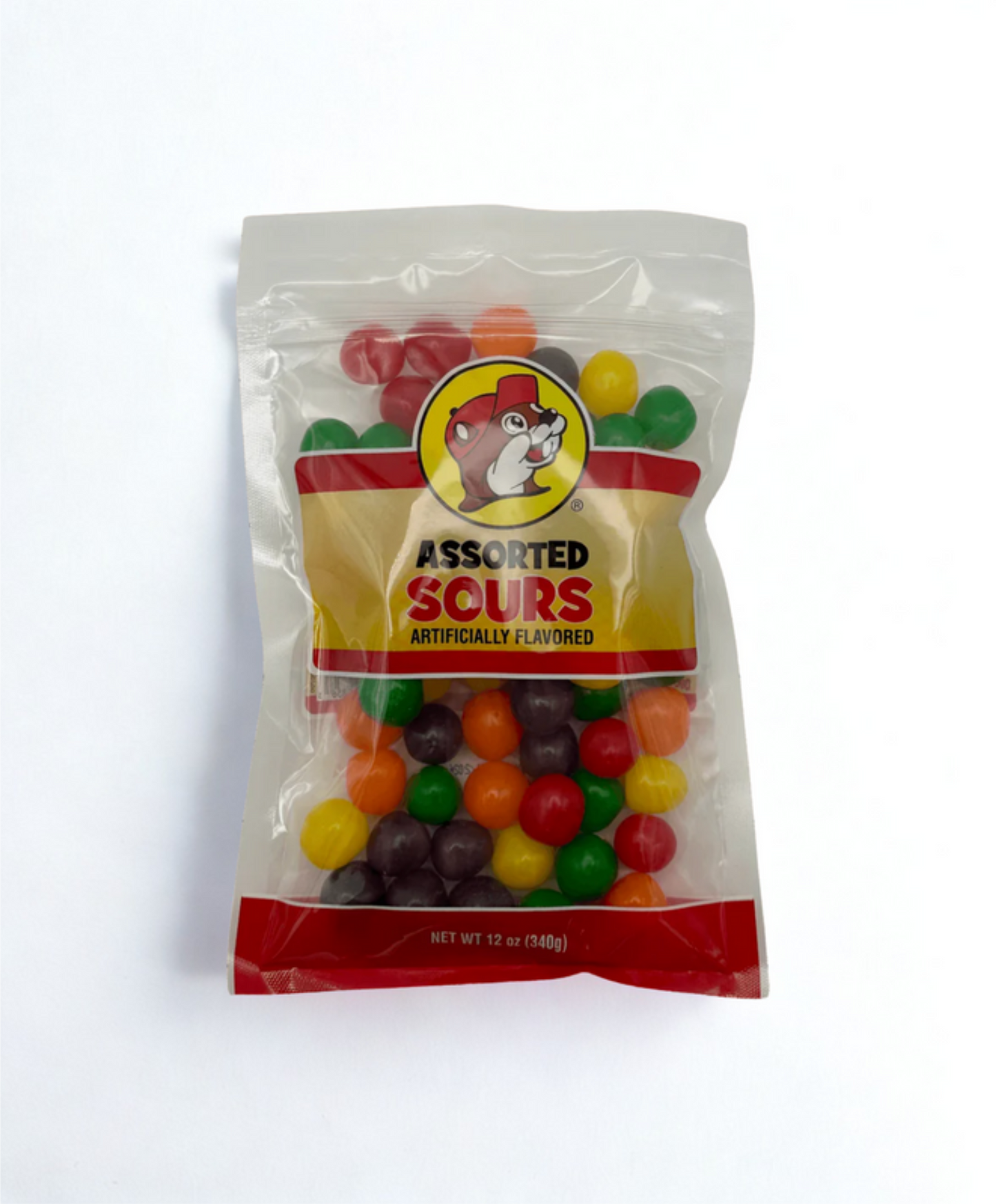 Packaged assorted sour gummy candies on a wooden surface