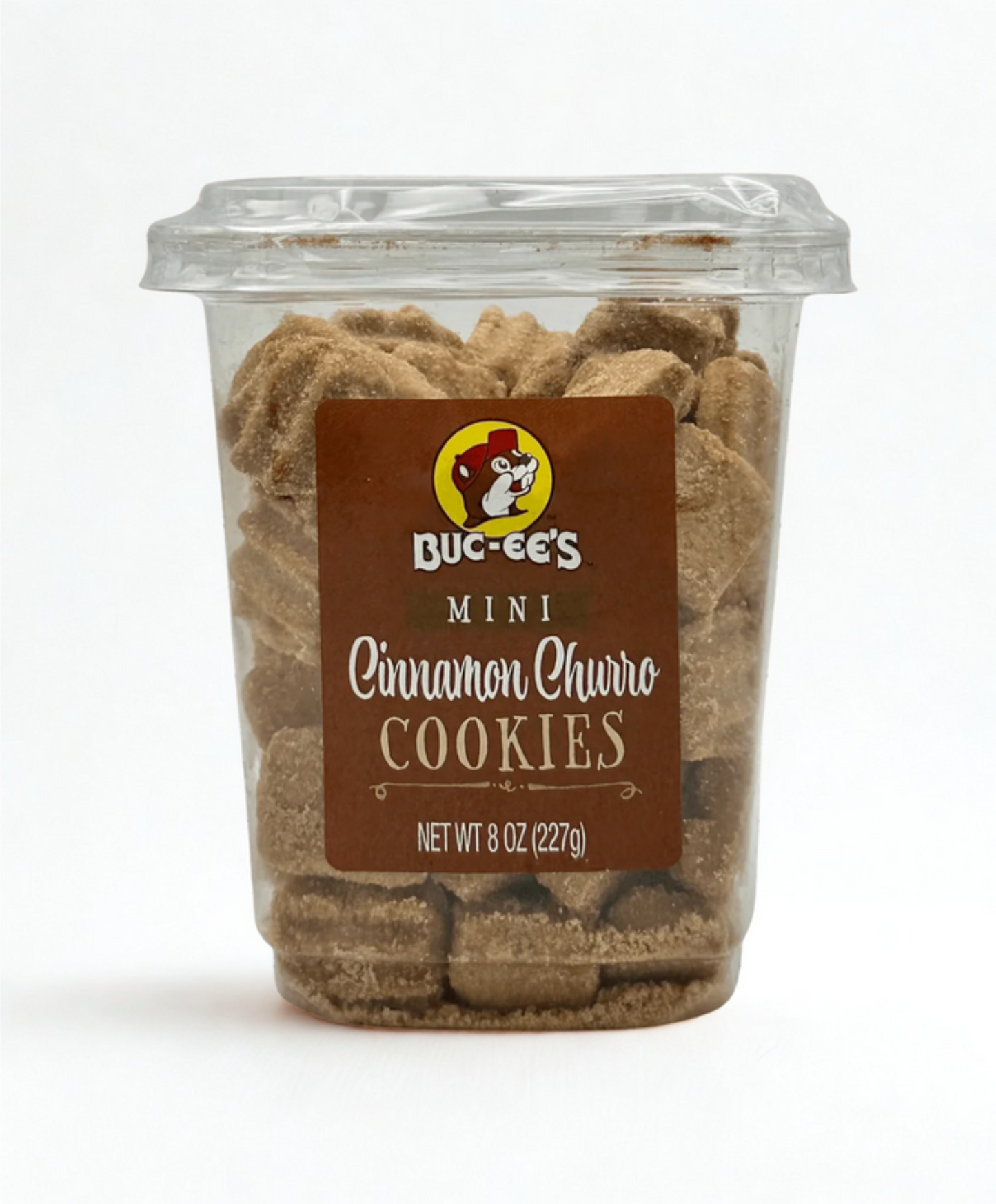 Container of Bucée's Mini Cinnamon Churro Cookies on a wooden surface