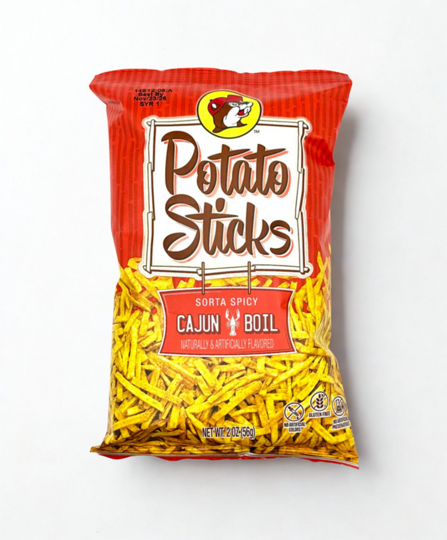 Bag of potato sticks with Cajun boil flavor on a wooden surface