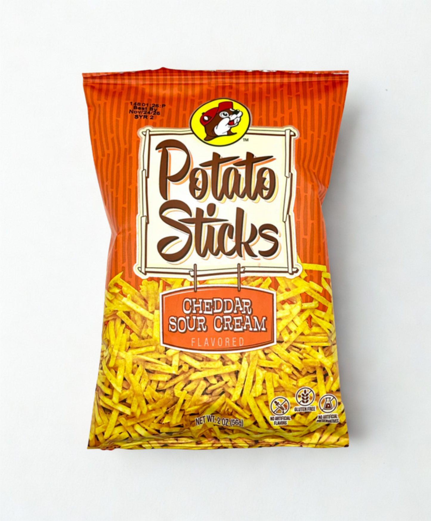 Bag of Cheddar Sour Cream flavored potato sticks on a wooden surface