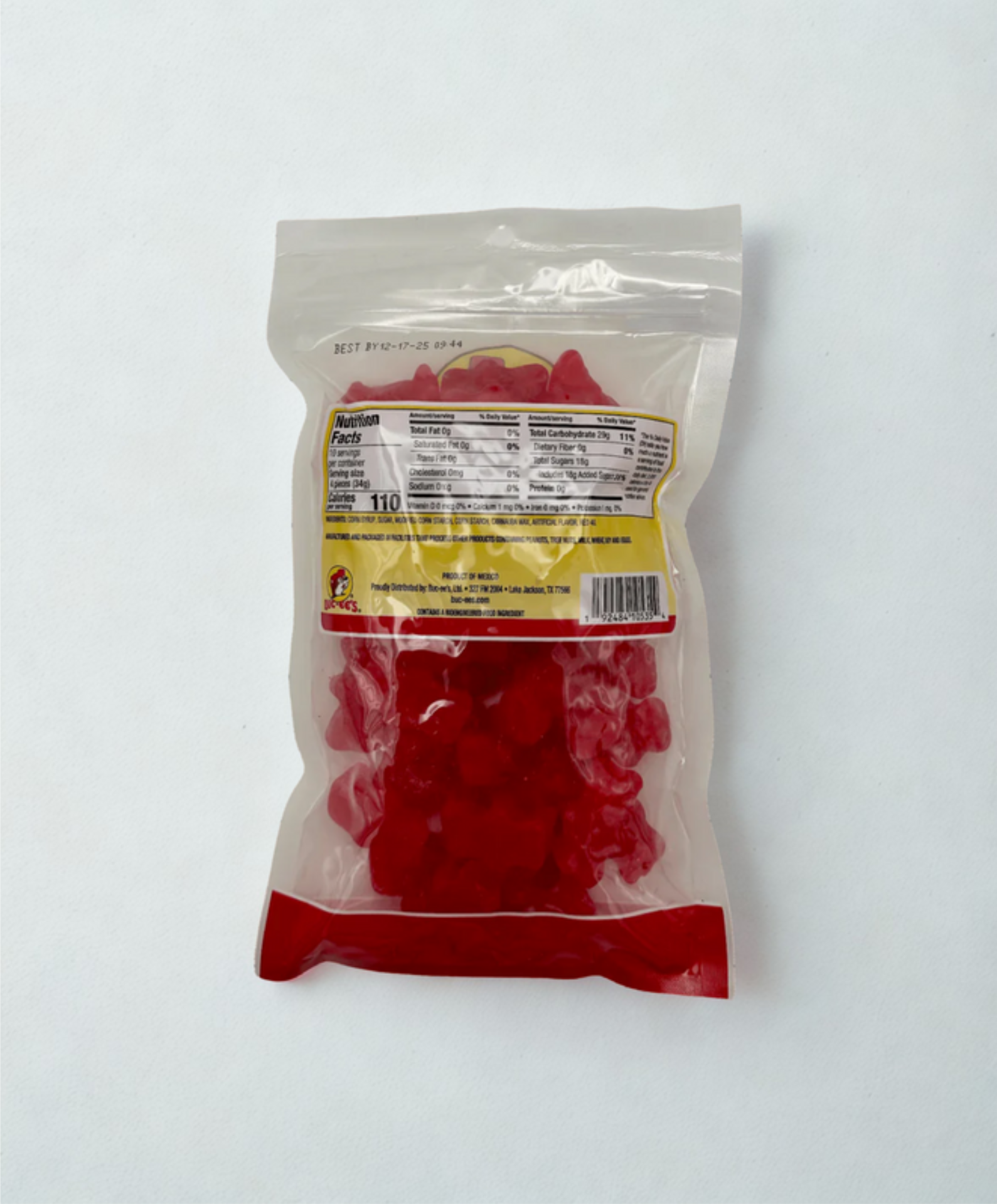 Bag of red gummy bears with a clear top on a wooden surface