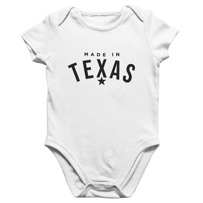 White baby onesie with 'Made in Texas' text on a white background