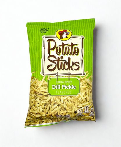Bag of dill pickle flavored potato sticks on a wooden surface